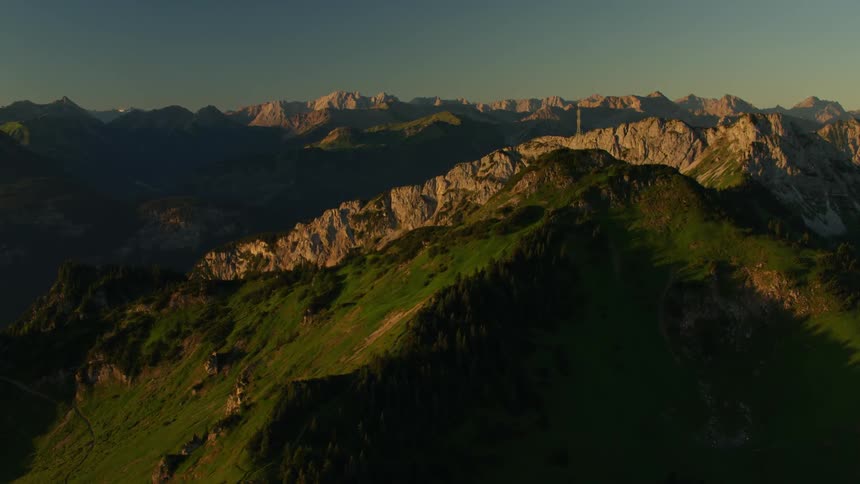 Large cross sitting high above on a mountaintop