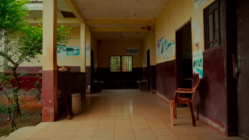 Static view of a desolate, weathered hallway in a forgotten building, evoking a sense of stillness and abandonment