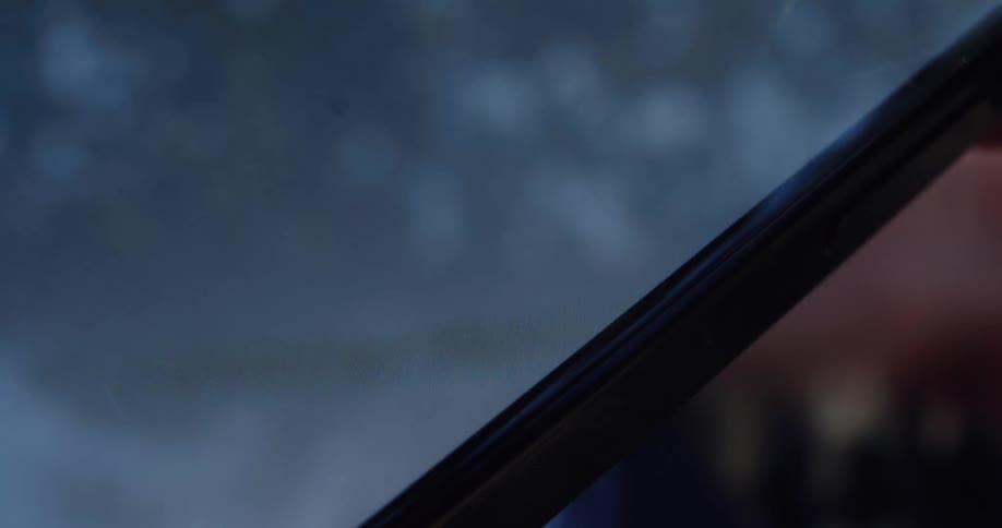 An intimate close-up shot of a finger pressing the send button on a mobile phone's messaging application