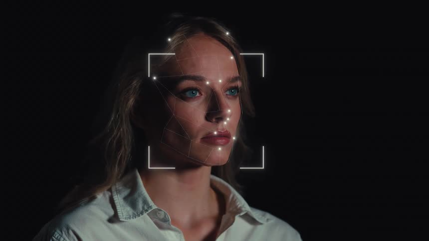 Biometric facial recognition technology scans a woman's face with a digital overlay, illustrating the concept of AI security
