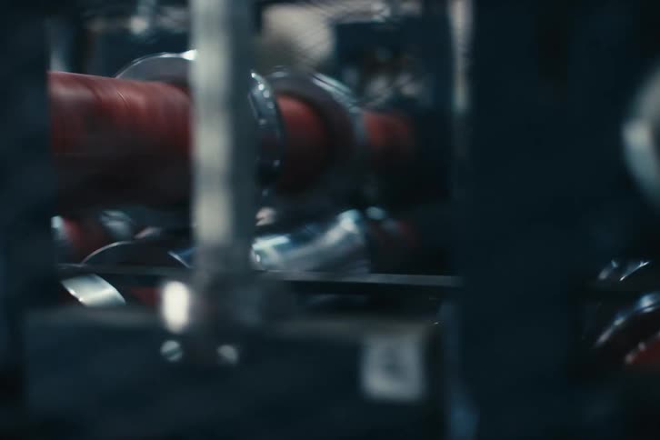 Industrial conveyor belt machinery with spinning rollers operating in a modern manufacturing plant