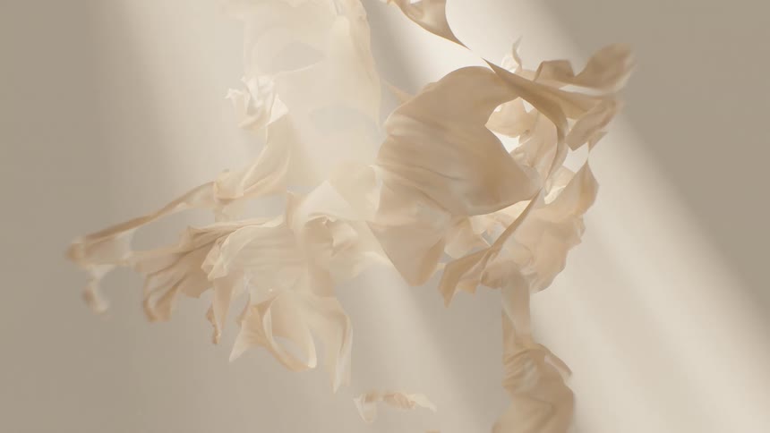 Ethereal and abstract cinemagraph of delicate, beige papers floating in soft, shifting light