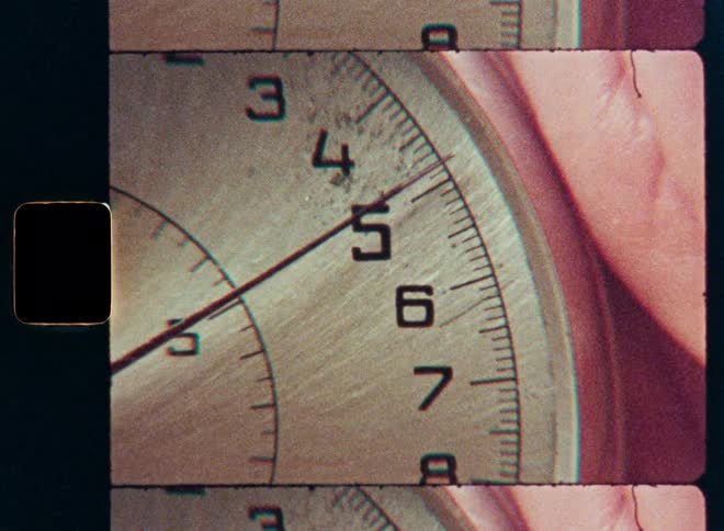Close-up of a stopwatch dial as the second hand sweeps across the numbers, captured on vintage film with a split-frame effect
