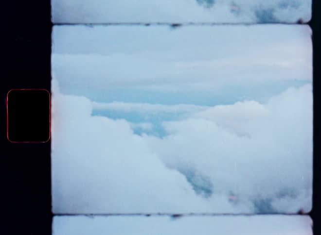 A vintage film strip aesthetic shows a serene view from above the fluffy white clouds in a pale blue sky