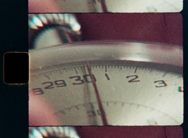 Macro shot of a vintage stopwatch counting seconds, captured on old film with a classic split-screen effect