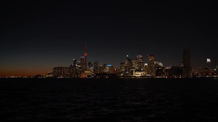 Stunning timelapse of the Toronto city skyline transitioning from a beautiful dusk into a brightly lit night