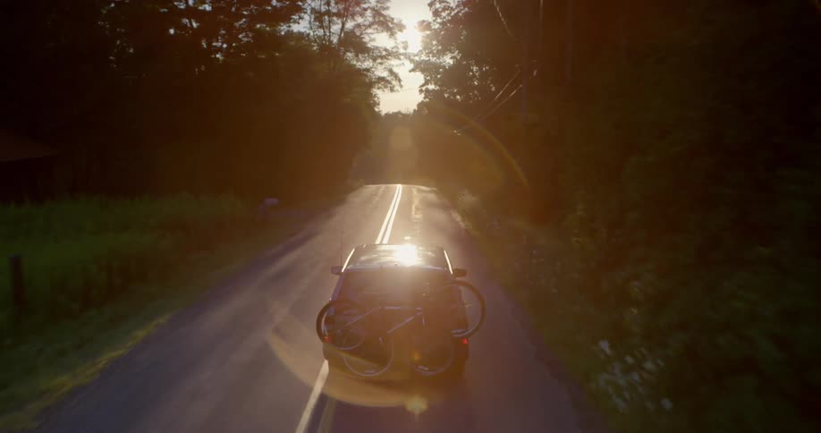 Car driving down a country road