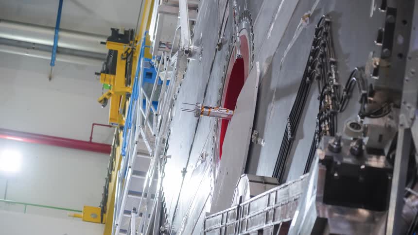 Vertical dolly out shot reveals the immense scale and complexity of the Large Hadron Collider particle detector at CERN