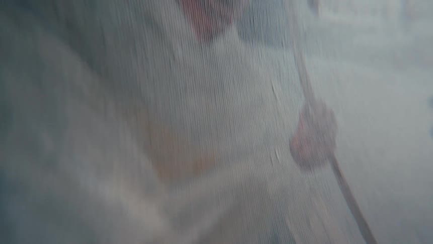 A slow, close-up pan across the textured canvas of an abstract oil painting