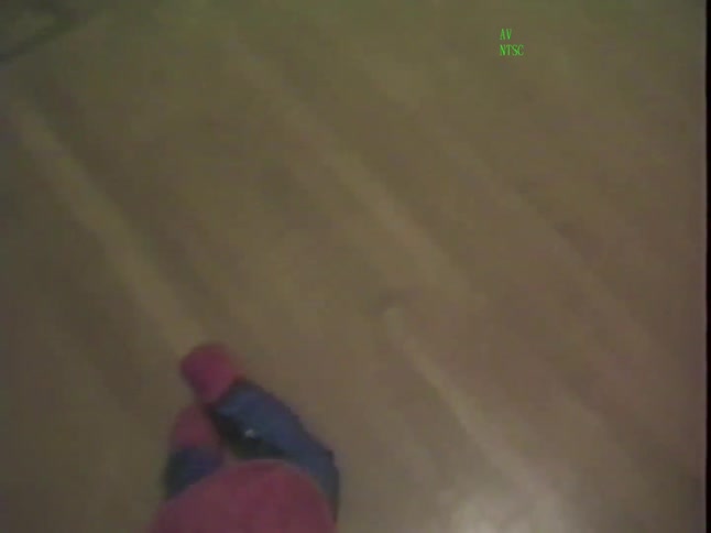 A vintage 1987 home video shows a toddler in a lion costume and a baby in a Superman costume on Halloween night