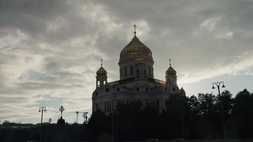A stunning view of Moscow's Cathedral of Christ the Saviour emerges as the focus pulls from rain-soaked glass to the sun-drenched domes