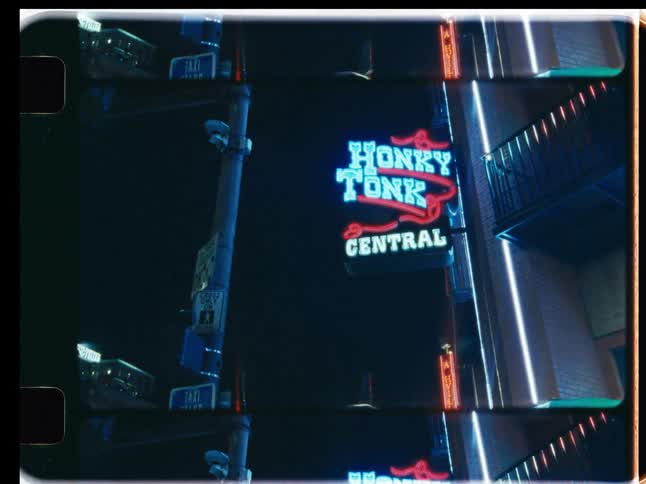 A stylized, vintage triple-frame view of the flashing 'Honky Tonk Central' neon sign at night