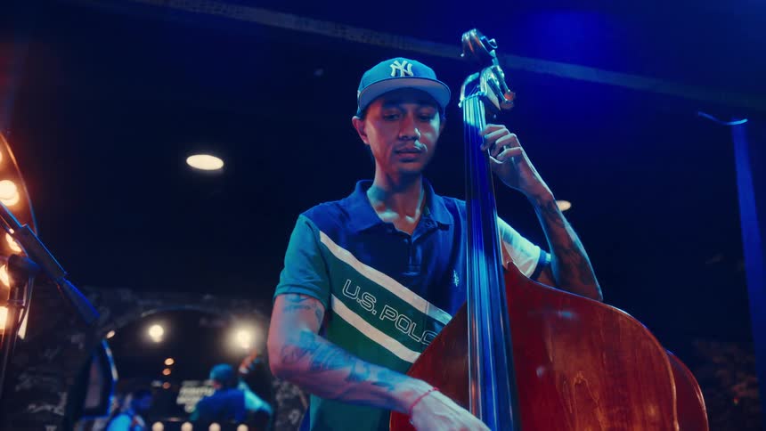 Dynamic close-up shots of a jazz trio, featuring a drummer, bassist, and pianist, performing live at a dimly lit music club