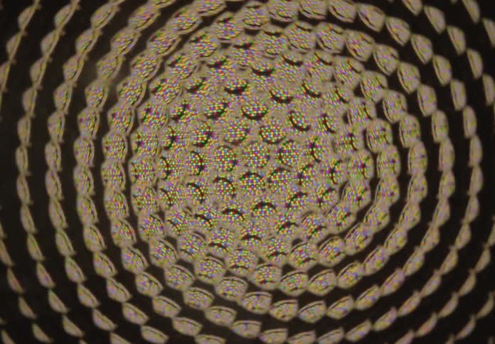 A mesmerizing kaleidoscopic view shows a rotating spiral of abstract colorful patterns