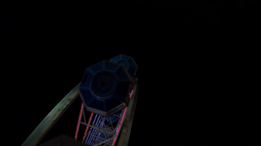 A low-angle shot captures a Ferris wheel gondola ascending with flashing lights against the dark night sky