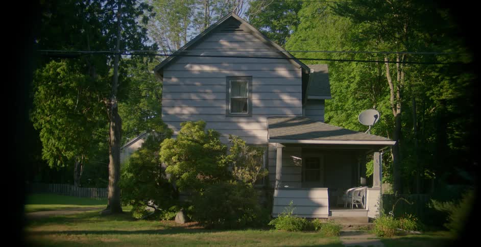 Small two-story house in a rural area