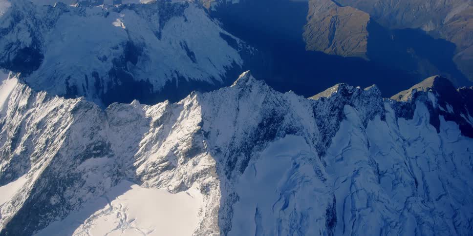 The mountain is jagged with ice on top