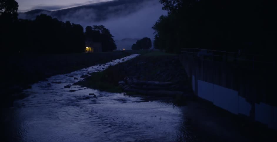 The stream is running in the wilderness at night