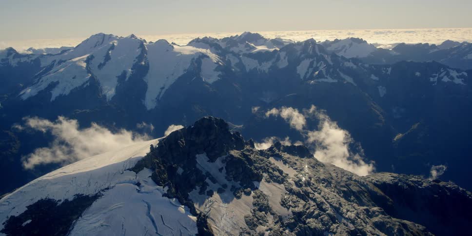 The mountains covered with ice and clouds