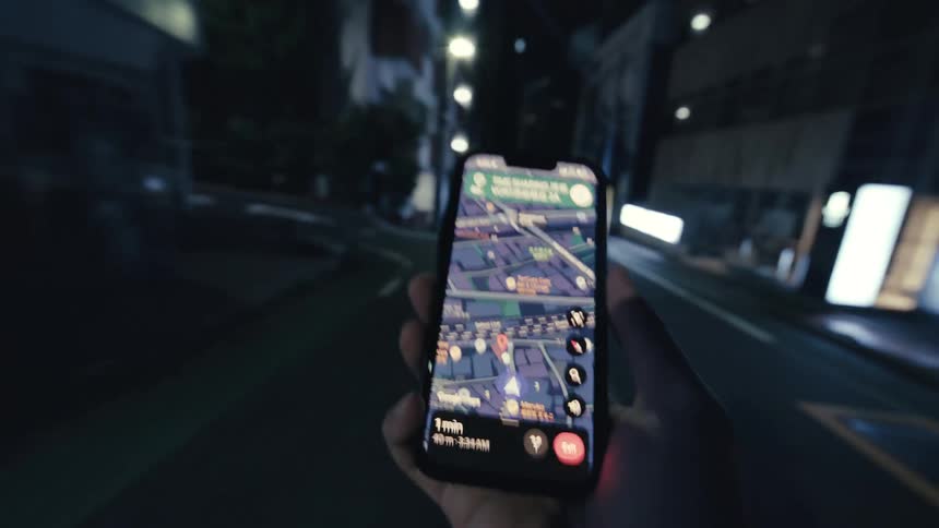 A surreal first-person view of walking through a city at night, guided by a distorted and glitching navigation map on a smartphone