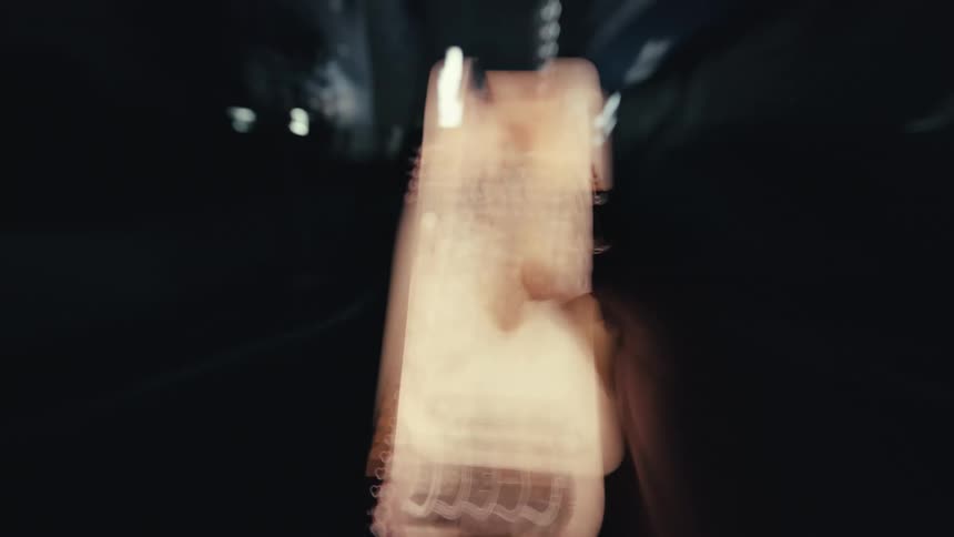 An abstract and frantic first-person view of scrolling on a smartphone at night, visualizing the chaos of information overload