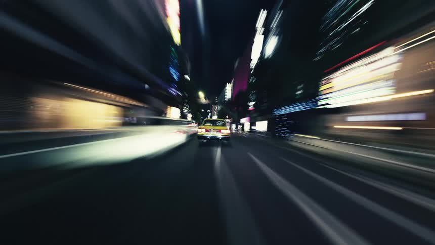 An exhilarating point-of-view hyperlapse of a car speeding through a bustling city at night, with neon lights blurring into streaks