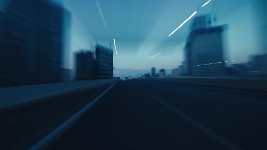 A dynamic point-of-view hyper-lapse drive through a modern city at dusk, with skyscrapers and light trails blurring at high speed