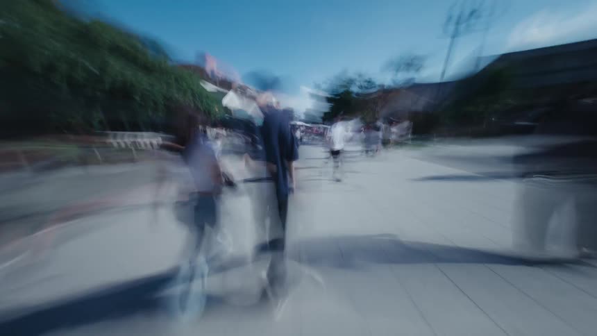 A disorienting first-person hyperlapse captures the energetic rush of walking through a crowded temple street market in Tokyo, with heavy motion blur