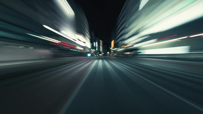 An exhilarating POV hyper-lapse drive through the neon-lit, empty streets of a bustling city at night