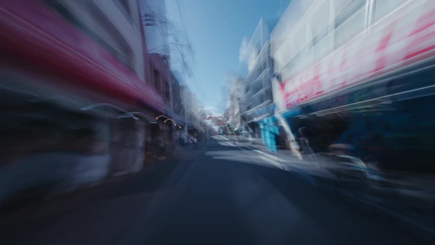 A surreal first-person view hyperlapse rushes through the bustling, motion-blurred streets of a Japanese city market