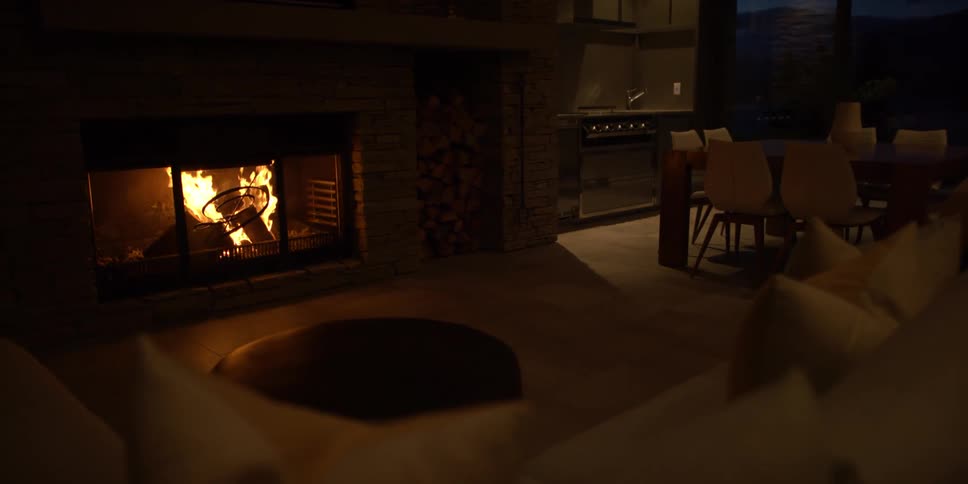 The fireplace is on in this living room