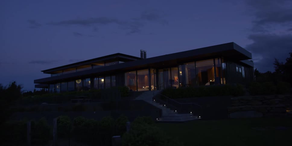 A large home is at the top of the hill