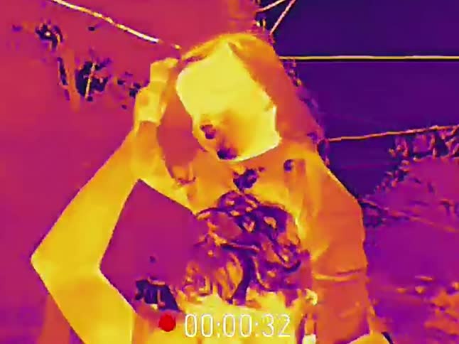 Surreal thermal camera footage captures a man carrying someone on his shoulders before the camera falls, revealing a bullet shell casing
