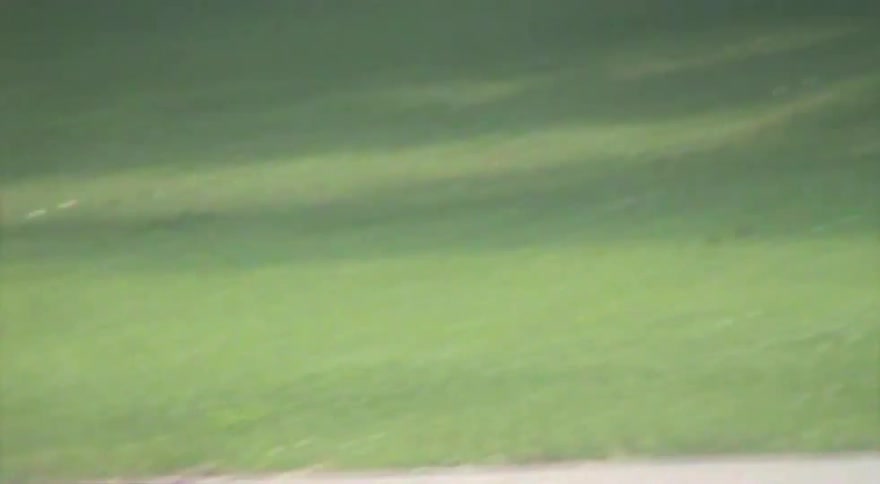 Vintage VHS-style footage shows a young man skateboarding and dancing at an outdoor skatepark