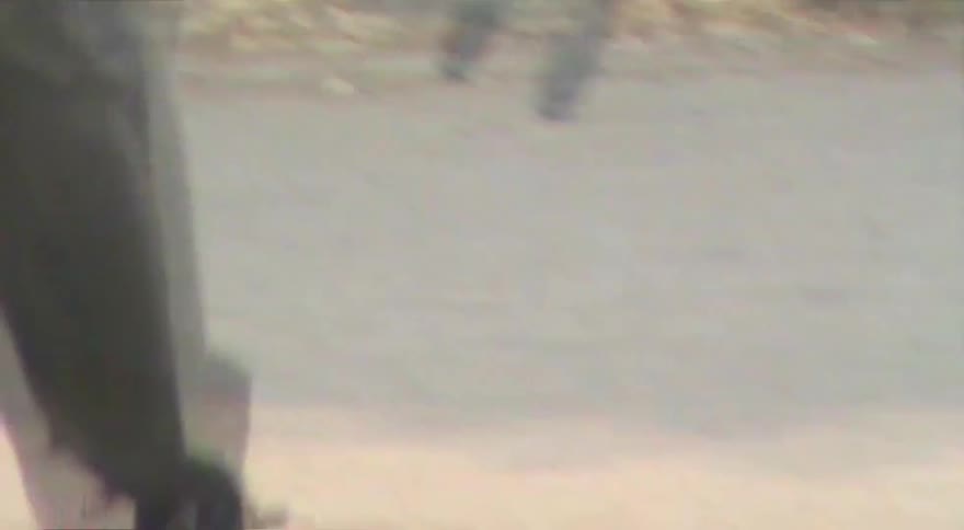 Dreamy, vintage-style footage follows a young man with dreadlocks as he skateboards in an urban park