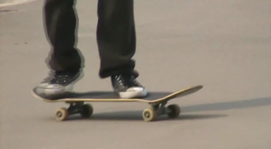 Stylized, vintage-style footage follows a person skateboarding and landing a flip trick with a ghosting effect