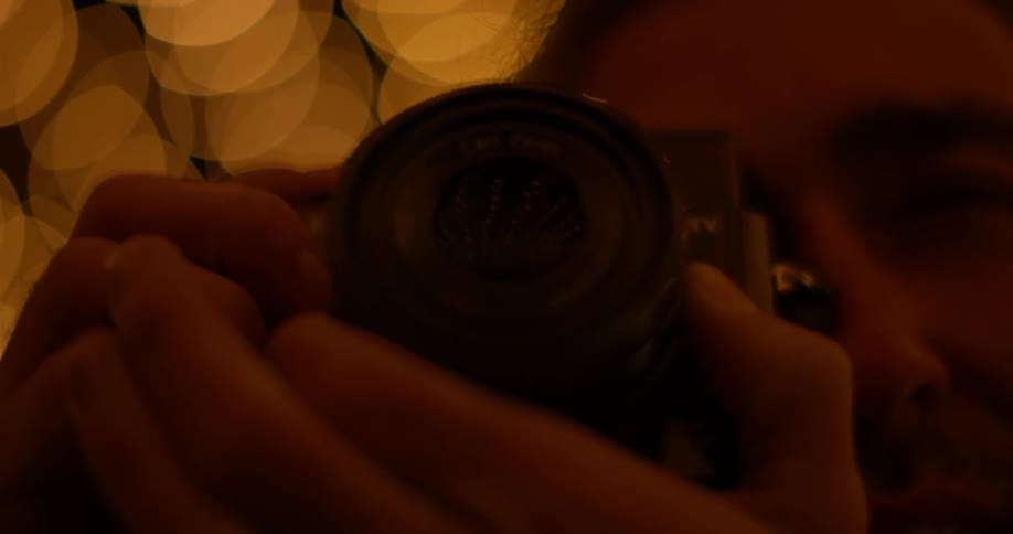 A person is using a camera at night