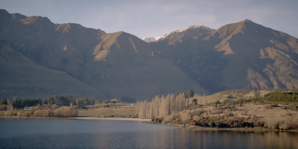 A lake is surrounded by mountains