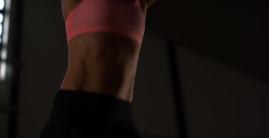 Woman slams a medicine ball down