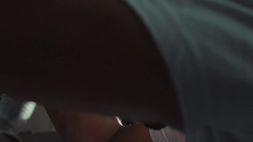 Dramatic slow-motion close-up of a chef rinsing fresh vegetables in a professional kitchen