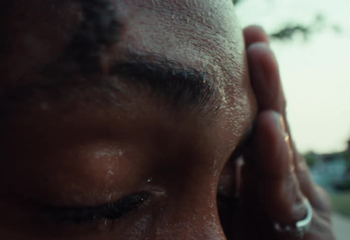 Extreme close-up on the eye of a sweaty and determined man after an intense workout