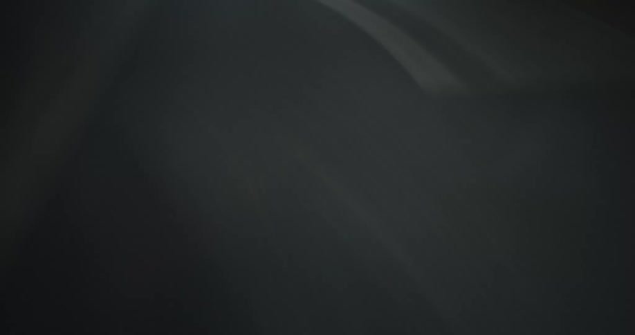 A hypnotic hyper-lapse captures the blurred perspective of a fast-paced night drive on a highway