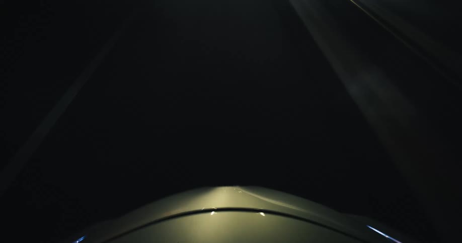 A mesmerizing point-of-view time-lapse from a car's roof captures the blur of city lights while driving at night