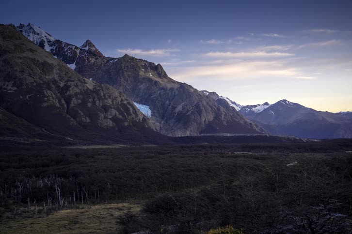 A stunning timelapse captures the sunrise over a majestic, snow-capped mountain range in Patagonia