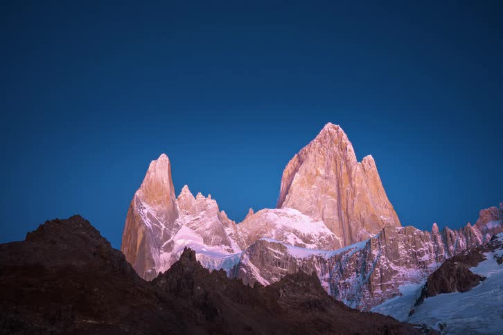 An awe-inspiring time-lapse shows stars moving across the night sky before a brilliant sunrise illuminates the snow-covered peaks of Mount Fitz Roy in Patagonia