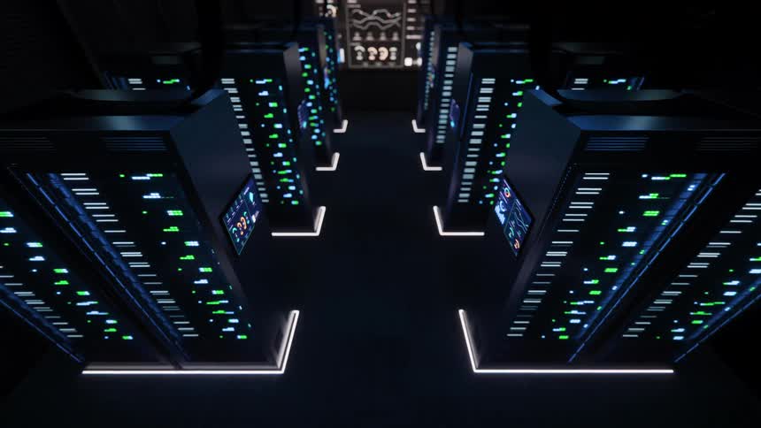 Retreating overhead shot through a modern data center aisle with blinking server racks and illuminated floor lighting