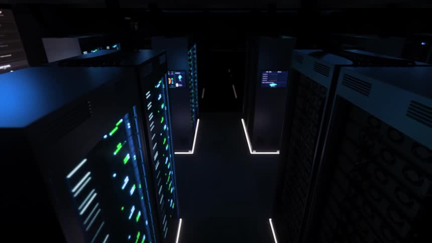 A slow, high-angle dolly shot through a dark, futuristic server room where racks of computers blink with activity