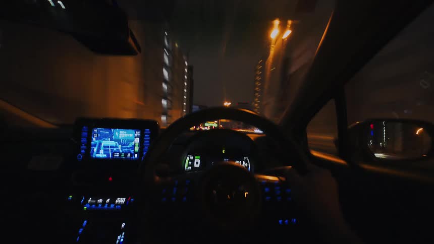 Dynamic first-person perspective timelapse of driving through an urban landscape and tunnels at night
