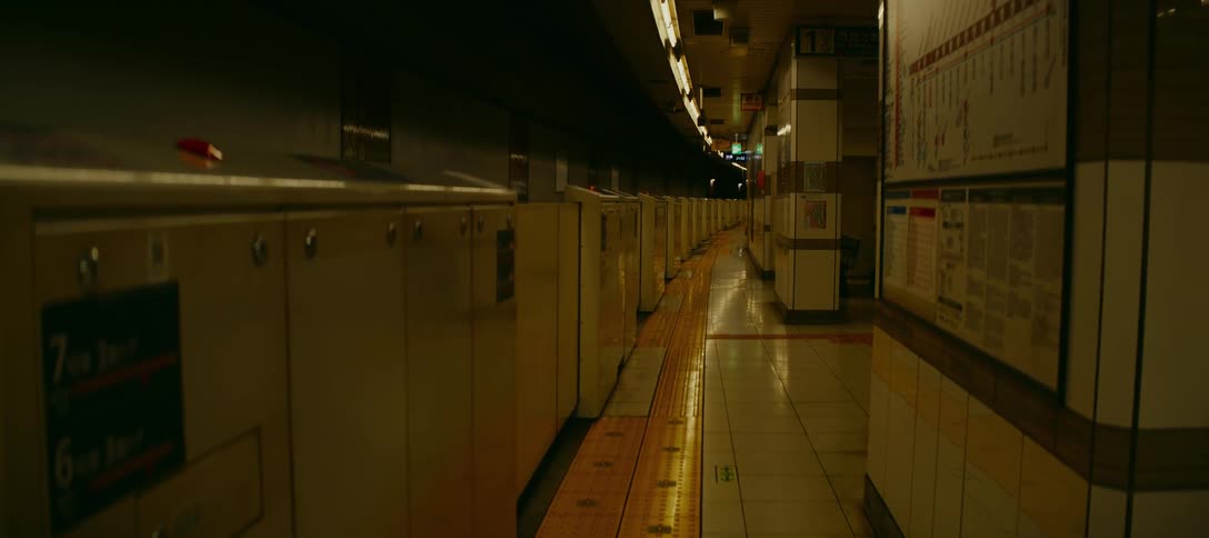 A cinematic shot of a deserted and dimly lit underground subway platform