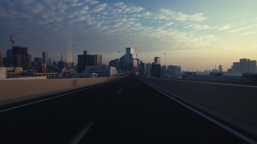 A cinematic hyper-lapse POV driving on a highway towards a modern city skyline at sunrise